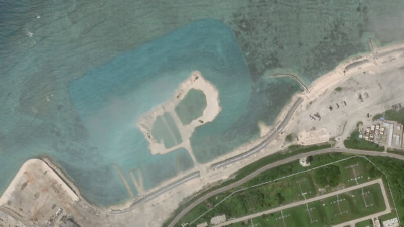 Satellite imagery shows a patch of reef in Woody Island's northwest that has been dredged up, as indicated by the blue color of the water around it, Oct. 5, 2020. [Planet Labs Inc.]